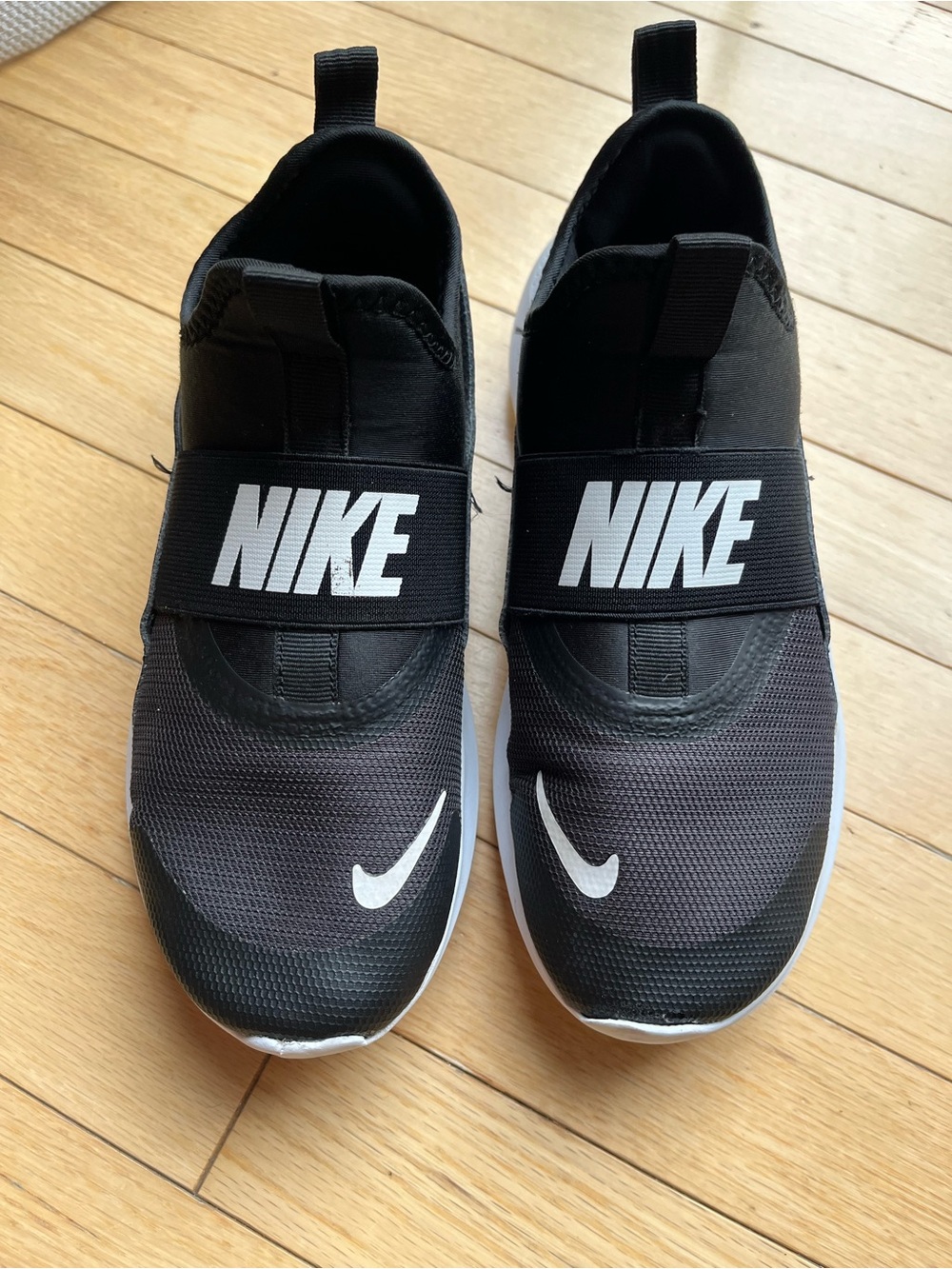 Nike boys Black and White Slip-On Athletic Sneakers - size 4.5